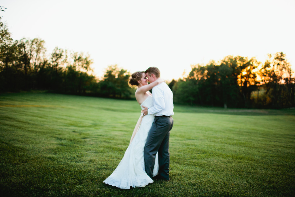 Marriage Mission Statement, Bride and Groom in field at sunset, rustic barn wedding