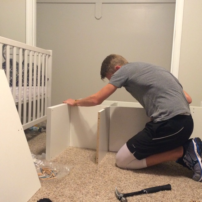 The hubby hard at work on our nursery closet while I put my feet up and "supervise." Doesn't get much better than that!