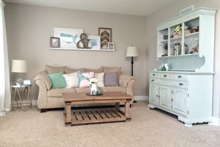 Our front room with some fun sale pieces from World Market and a free hutch we inherited.