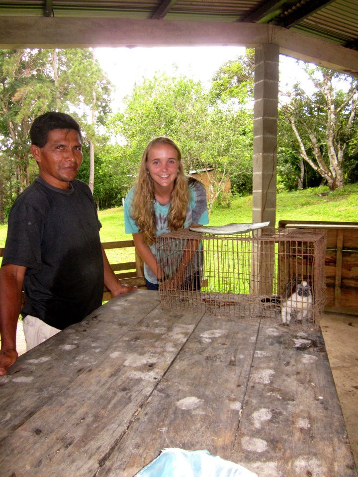 My host dad and I with a monkey he caught (and released soon after because monkeys are really stinking mean!)